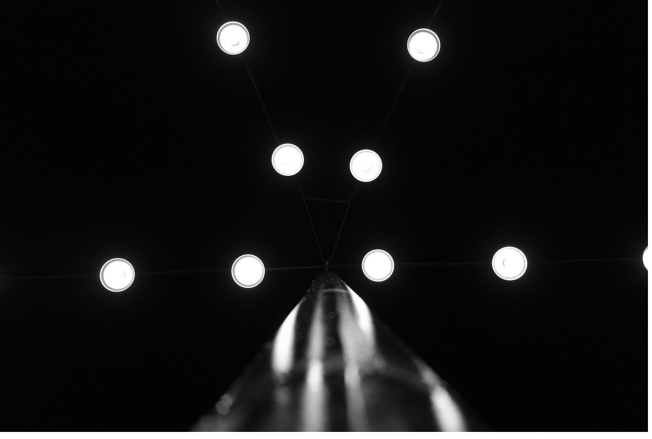 String lights converging against a night sky